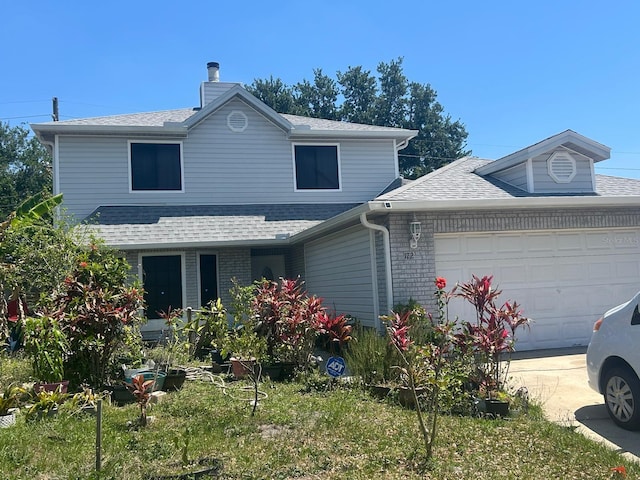 172 Pinewood Cir, Kissimmee, FL 34743 - traditional home featuring a shingled roof, an attached garage, driveway, and a chimney