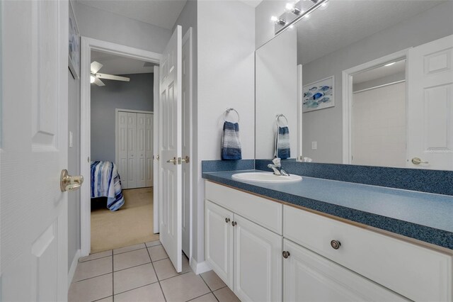 4796 Cumbrian Lakes Dr, Kissimmee, FL 34746 - bathroom with vanity, tile patterned floors, a ceiling fan, and connected bathroom