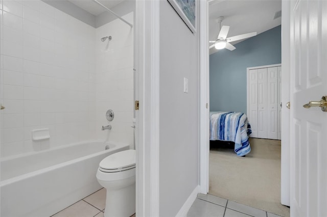 4796 Cumbrian Lakes Dr, Kissimmee, FL 34746 - ensuite bathroom with tile patterned floors, bathing tub / shower combination, toilet, a ceiling fan, and baseboards