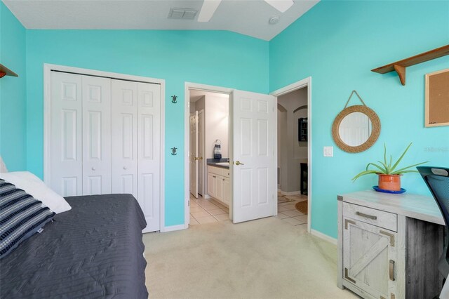 4796 Cumbrian Lakes Dr, Kissimmee, FL 34746 - bedroom with lofted ceiling, light carpet, a closet, baseboards, and light tile patterned flooring