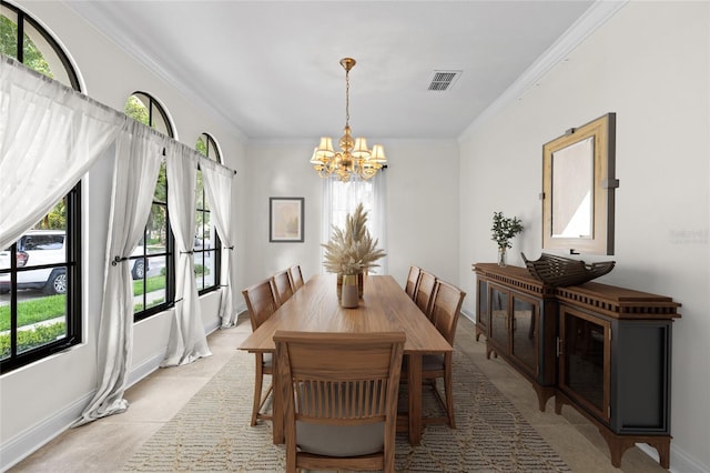 1047 Banks Rose St, Kissimmee, FL 34747 - dining space with a chandelier, crown molding, baseboards, and light tile patterned flooring