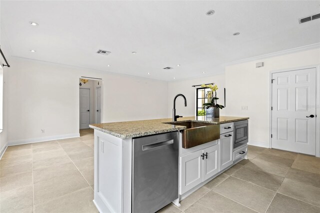 1047 Banks Rose St, Kissimmee, FL 34747 - kitchen with stainless steel appliances, a sink, light stone counters, an island with sink, and light tile patterned floors