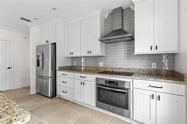 1047 Banks Rose St, Kissimmee, FL 34747 - kitchen featuring stainless steel appliances, wall chimney exhaust hood, decorative backsplash, ornamental molding, and white cabinetry