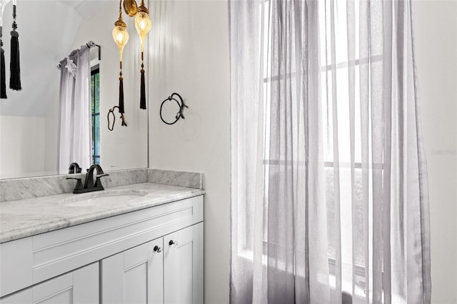 1047 Banks Rose St, Kissimmee, FL 34747 - bathroom with vaulted ceiling and vanity