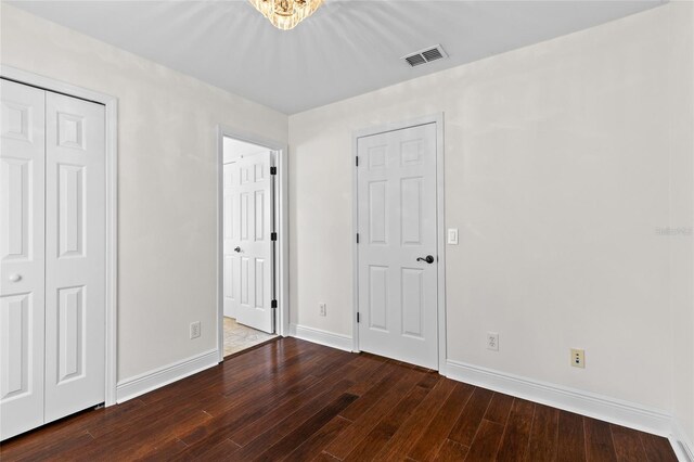 1047 Banks Rose St, Kissimmee, FL 34747 - unfurnished bedroom featuring hardwood / wood-style floors and baseboards