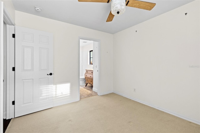 1047 Banks Rose St, Kissimmee, FL 34747 - unfurnished bedroom featuring light carpet, baseboards, ensuite bath, and a ceiling fan