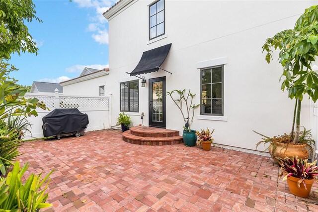 1047 Banks Rose St, Kissimmee, FL 34747 - view of patio with fence and a grill