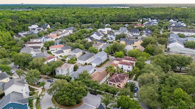 1047 Banks Rose St, Kissimmee, FL 34747 - aerial perspective of suburban area featuring a heavily wooded area