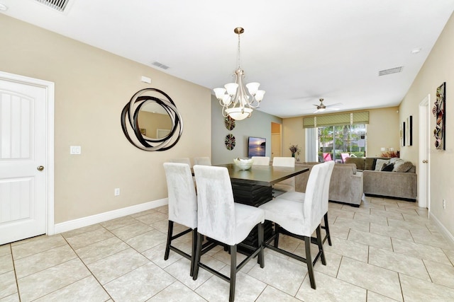 4416 Acorn Ct, Davenport, FL 33837 - dining room featuring a chandelier, ceiling fan, light tile patterned floors, and baseboards