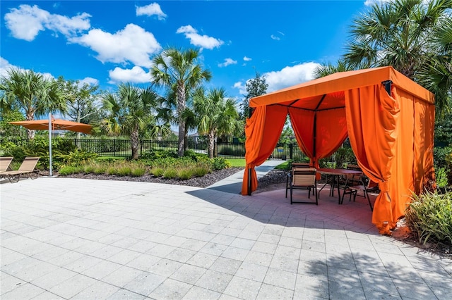4416 Acorn Ct, Davenport, FL 33837 - view of patio featuring a gazebo, fence, and outdoor dining space