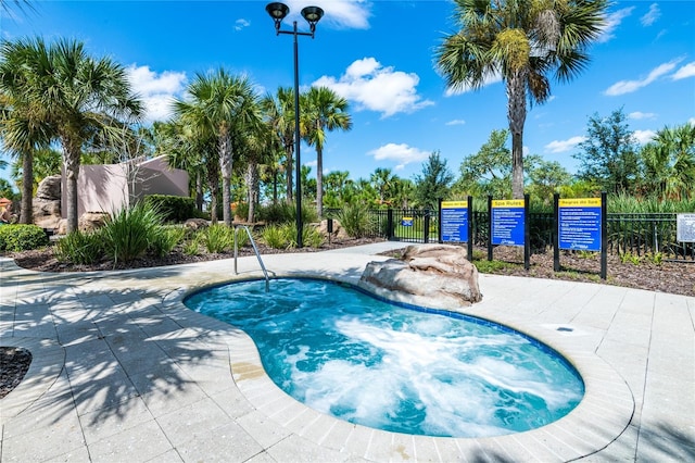 4416 Acorn Ct, Davenport, FL 33837 - view of pool with fence and a community hot tub