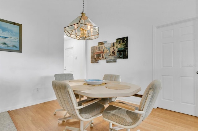 2473 Saint Augustine Blvd, Haines City, FL 33844 - dining space with a chandelier, light wood-type flooring, and baseboards