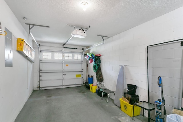 2473 Saint Augustine Blvd, Haines City, FL 33844 - garage featuring a garage door opener, electric panel, and concrete block wall