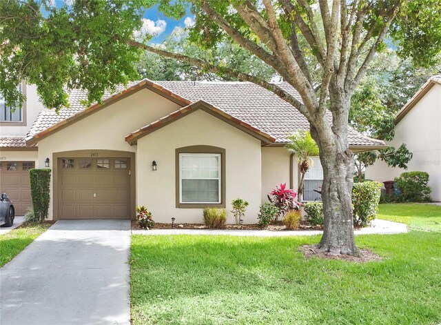 2473 Saint Augustine Blvd, Haines City, FL 33844 - view of front facade with a tile roof, stucco siding, a front lawn, concrete driveway, and a garage