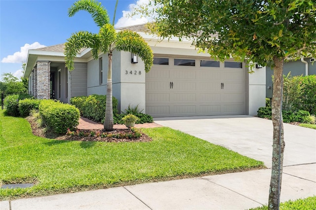 3428 Sagebrush St, Saint Cloud, FL 34773 - view of front of house with driveway, a front lawn, stucco siding, and a garage