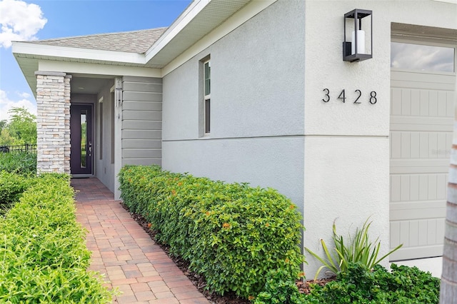 3428 Sagebrush St, Saint Cloud, FL 34773 - entrance to property with stucco siding and roof with shingles