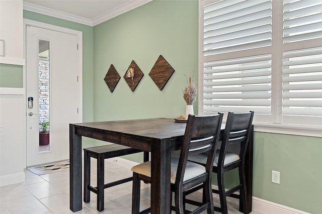 3428 Sagebrush St, Saint Cloud, FL 34773 - dining area featuring baseboards, light tile patterned floors, and crown molding