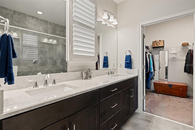 3428 Sagebrush St, Saint Cloud, FL 34773 - bathroom with double vanity, a spacious closet, a stall shower, and tile patterned flooring