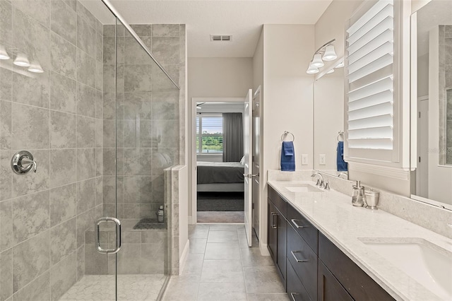 3428 Sagebrush St, Saint Cloud, FL 34773 - bathroom with double vanity, ensuite bathroom, a shower stall, and tile patterned floors