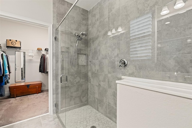 3428 Sagebrush St, Saint Cloud, FL 34773 - bathroom featuring a shower stall, a spacious closet, and tile patterned floors