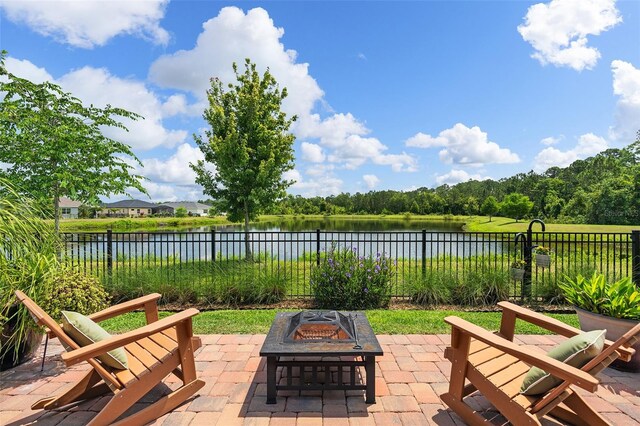 3428 Sagebrush St, Saint Cloud, FL 34773 - fenced backyard featuring a patio, a fire pit, and a water view