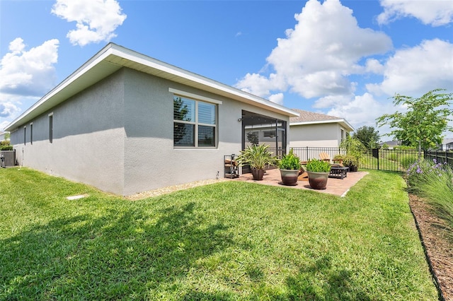 3428 Sagebrush St, Saint Cloud, FL 34773 - back of property with stucco siding, a patio area, a sunroom, and cooling unit