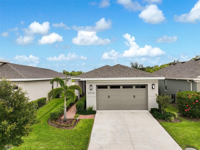 3428 Sagebrush St, Saint Cloud, FL 34773 - ranch-style home with stucco siding, a front lawn, driveway, and a garage