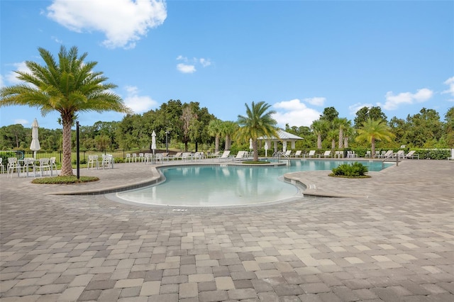 3428 Sagebrush St, Saint Cloud, FL 34773 - community pool with a patio area, a gazebo, and view of scattered trees