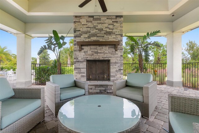 3428 Sagebrush St, Saint Cloud, FL 34773 - view of patio featuring a ceiling fan and an outdoor living space with a fireplace