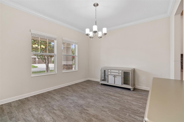 3138 Dark Sky Dr, Saint Cloud, FL 34773 - spare room featuring a chandelier, ornamental molding, wood finished floors, and baseboards
