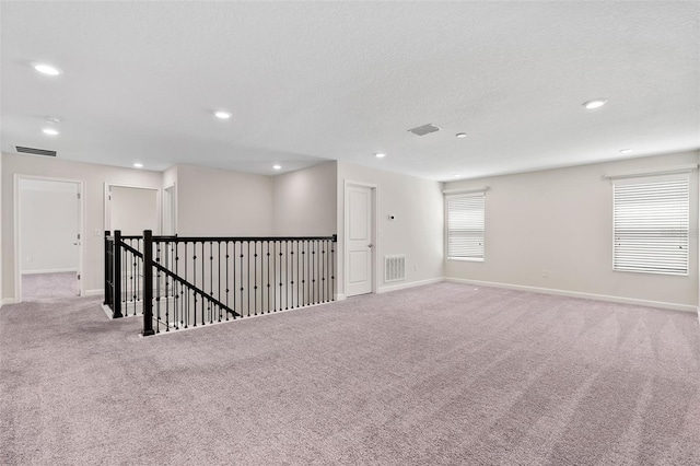 3138 Dark Sky Dr, Saint Cloud, FL 34773 - carpeted spare room featuring baseboards, recessed lighting, and a textured ceiling