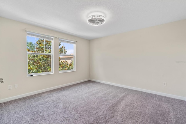3138 Dark Sky Dr, Saint Cloud, FL 34773 - spare room featuring baseboards and carpet floors