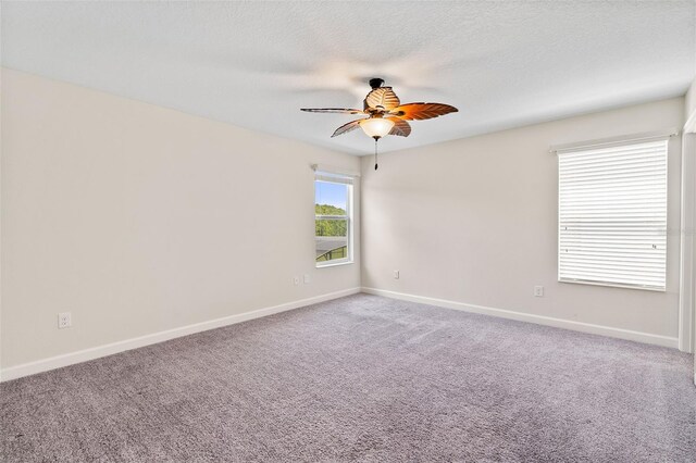 3138 Dark Sky Dr, Saint Cloud, FL 34773 - carpeted spare room with a ceiling fan, baseboards, and a textured ceiling