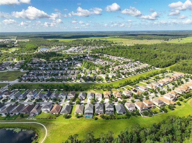 3138 Dark Sky Dr, Saint Cloud, FL 34773 - aerial view of property and surrounding area featuring a large body of water, nearby suburban area, and a forest
