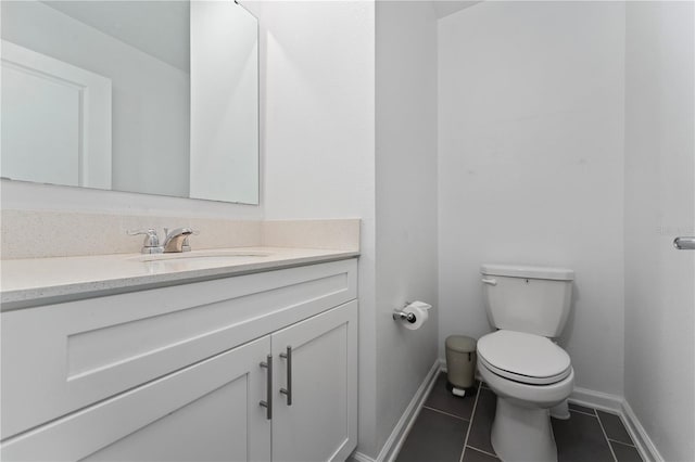 7728 Stone Creek Trl, Kissimmee, FL 34747 - half bathroom with vanity, tile patterned floors, toilet, and baseboards