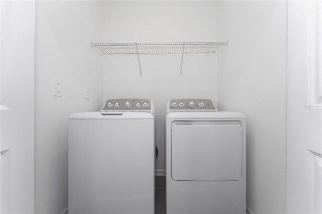 7728 Stone Creek Trl, Kissimmee, FL 34747 - laundry room featuring independent washer and dryer