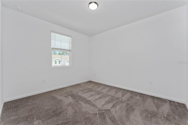 7728 Stone Creek Trl, Kissimmee, FL 34747 - empty room featuring carpet flooring, baseboards, and a smoke detector