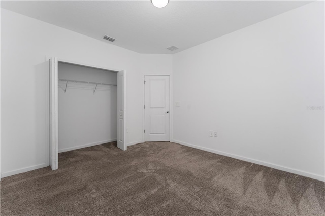 7728 Stone Creek Trl, Kissimmee, FL 34747 - unfurnished bedroom featuring carpet, a closet, and baseboards