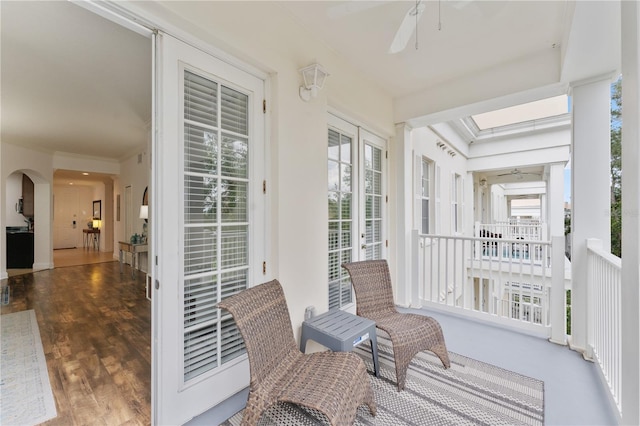 7509 Mourning Dove Cir Unit 303, Reunion, FL 34747 - sunroom featuring arched walkways