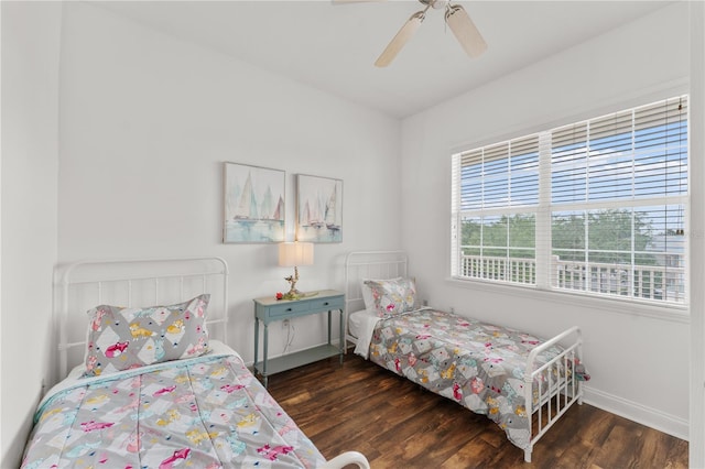 7509 Mourning Dove Cir Unit 303, Reunion, FL 34747 - bedroom featuring wood finished floors, baseboards, and ceiling fan