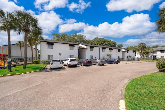 4403 S Semoran Blvd Unit 2, Orlando, FL 32822 - view of property featuring uncovered parking and fence