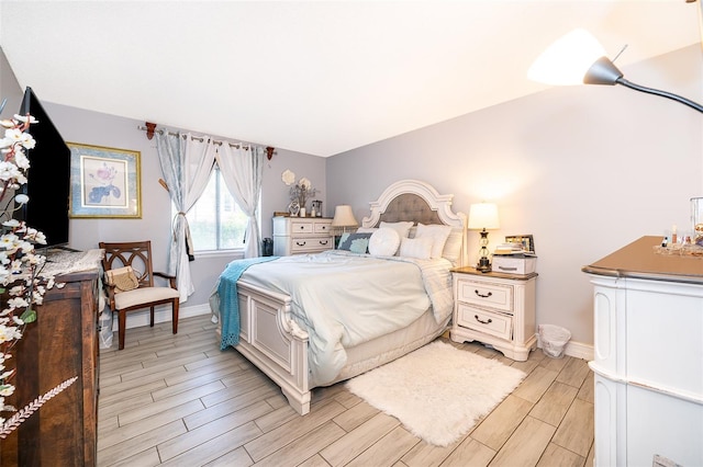4403 S Semoran Blvd Unit 2, Orlando, FL 32822 - bedroom with wood tiled floors and baseboards