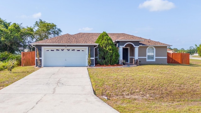 402 Ohio Way, Kissimmee, FL 34759 - view of front of house with a garage, concrete driveway, and stucco siding