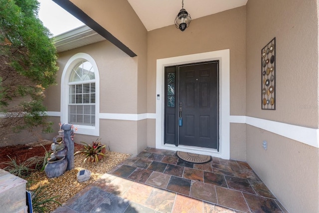 402 Ohio Way, Kissimmee, FL 34759 - view of exterior entry with stucco siding