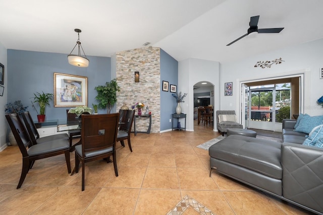 402 Ohio Way, Kissimmee, FL 34759 - dining space featuring arched walkways, lofted ceiling, ceiling fan, light tile patterned floors, and baseboards