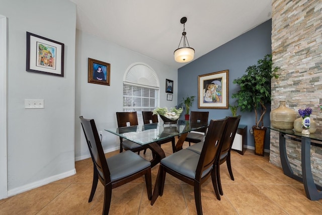 402 Ohio Way, Kissimmee, FL 34759 - dining room featuring light tile patterned flooring, baseboards, and vaulted ceiling