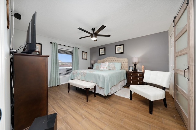 402 Ohio Way, Kissimmee, FL 34759 - bedroom with light wood finished floors, baseboards, and a ceiling fan