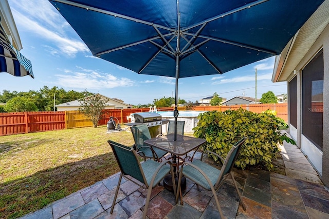 402 Ohio Way, Kissimmee, FL 34759 - view of patio / terrace with outdoor dining area and grilling area