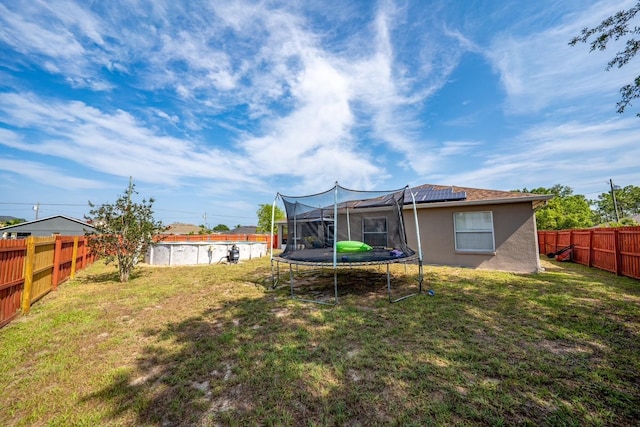 402 Ohio Way, Kissimmee, FL 34759 - view of yard featuring a trampoline
