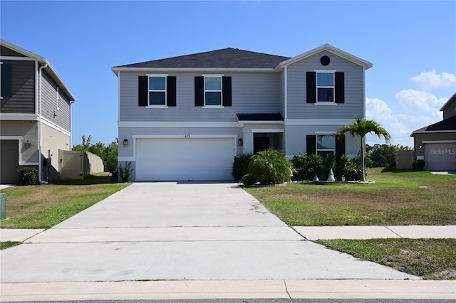 673 Sarner Pass Way, Winter Haven, FL 33881 - traditional home featuring driveway, an attached garage, a front yard, and a shingled roof